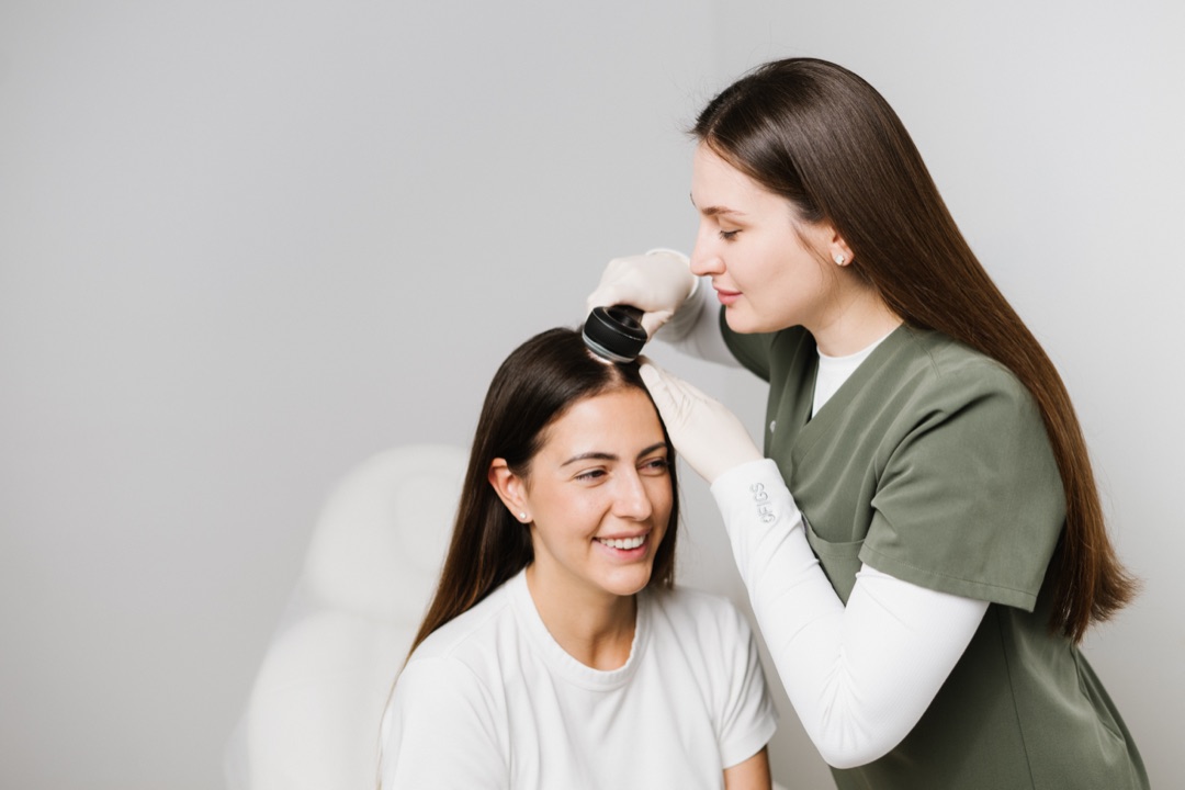 Yuna Shkhagosheva, dermatologist at GMS Clinic Dubai, scalp examination
