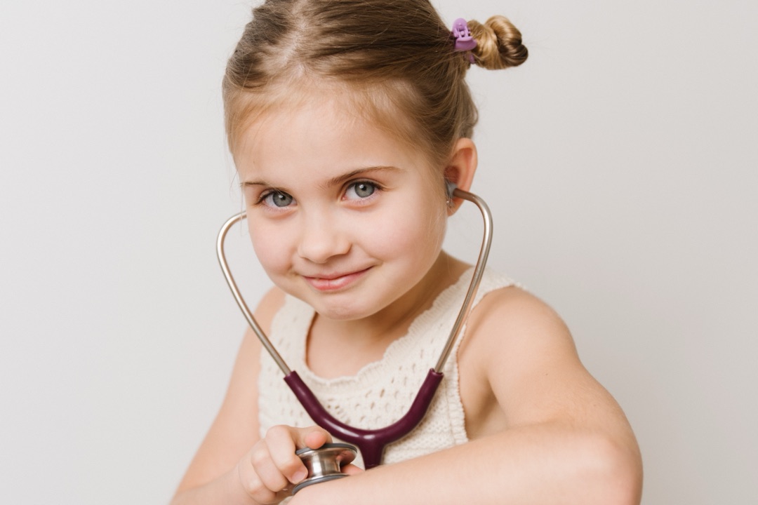 A young patient of GMS Clinic Dubai with a stethoscope