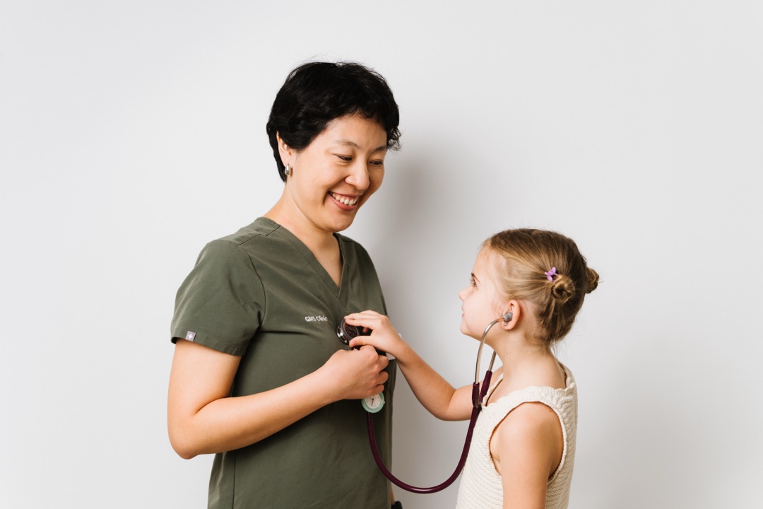 Irina Pronkinova, pediatrician and neurologist at GMS Clinic Dubai, with a young patient